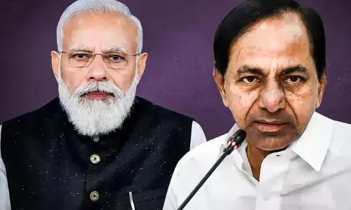 Amid PM Modi Hyderabad Tour, TRS Started a flexi war with anti modi slogans