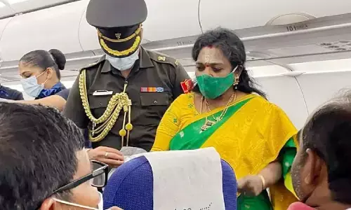 Telangana Governor Tamilisai Treats sick passenger on Flight