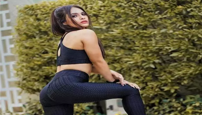 Neha Malik is Sultry Poses In Gym Dress