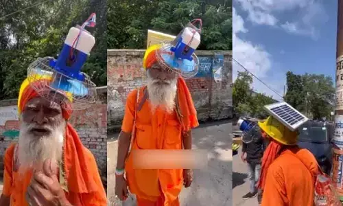 నెత్తికి ఫ్యాన్ బిగించుకుని తిరుగుతున్న సాధువు... నెట్టింట వైరల్ అవుతున్న (వీడియో)