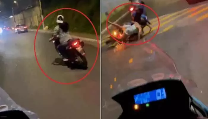 అడ్డగోలుగా బైక్ నడుపుతూ పక్కనోళ్లను కిందపడేసిన యువతి(వీడియో) అడ్డగోలుగా బైక్ నడుపుతూ పక్కనోళ్లను కిందపడేసిన యువతి(వీడియో)