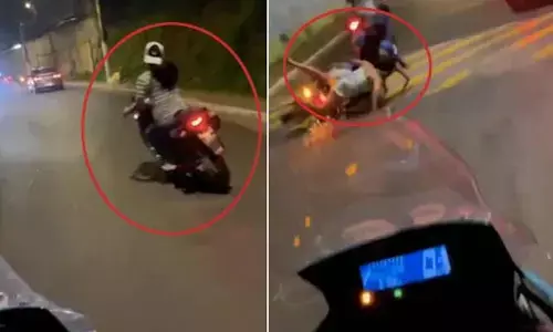 అడ్డగోలుగా బైక్ నడుపుతూ పక్కనోళ్లను కిందపడేసిన యువతి(వీడియో)