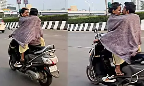 డేంజరేస్ డ్రైవింగ్‌తో స్కూటీపై రొమాన్స్‌తో రెచ్చిపోయిన ప్రేమ జంట(వీడియో)