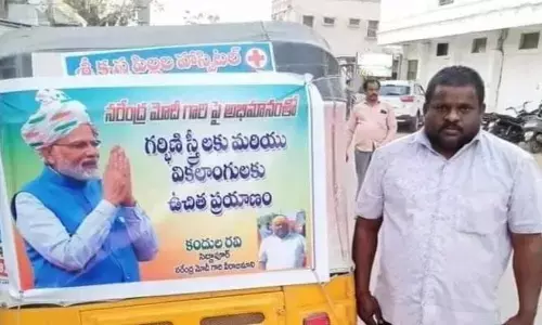 మోడీపై అభిమానంతో ఆటోవాలా గొప్ప మనసు ..నెటిజన్ల ప్రశంసలు