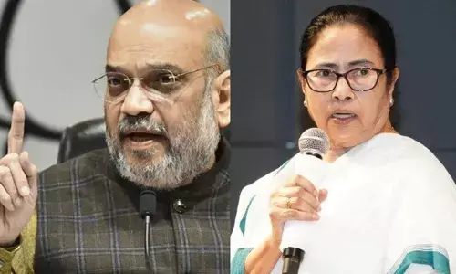 బీజేపీకి ఓటేయ్యండి.. మమతా బెనర్జీ గూండాలను తలకిందులుగా వేలాడదీస్తాం