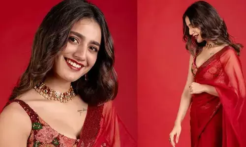 రెడ్ శారీలో ముద్ద మందారంలా మెరిసిపోతున్న ప్రియా వారియర్.. ఫోటోలు వైరల్