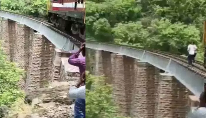 రైల్వే ట్రాక్పై ఫొటో షూట్.. సడెన్గా ట్రైన్ రావడంతో 90 అడుగుల లోతులోకి దూకడంతో..4 రైల్వే ట్రాక్పై ఫొటో షూట్.. సడెన్గా ట్రైన్ రావడంతో 90 అడుగుల లోతులోకి దూకడంతో..4