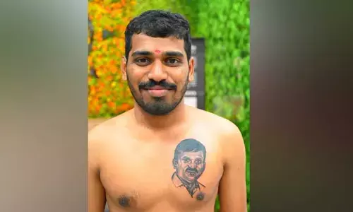 మంత్రి పై అభిమానం చాటుకున్న యువకుడు.. ఛాతి పై పచ్చబొట్టు..