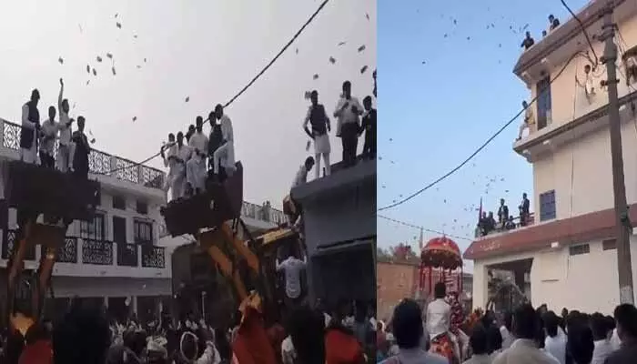 Viral: పెళ్లి ఊరేగింపులో నోట్ల వర్షం.. అందుకునేందుకు ఎగబడిన జనం (వీడియో) Viral: పెళ్లి ఊరేగింపులో నోట్ల వర్షం.. అందుకునేందుకు ఎగబడిన జనం (వీడియో)