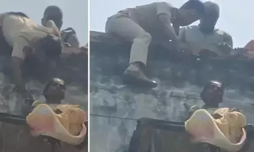 భార్యా,భర్తల మధ్య గొడవ.. భర్తతో పాటు పోలీసులకూ చుక్కలు చూపించిన మహిళ
