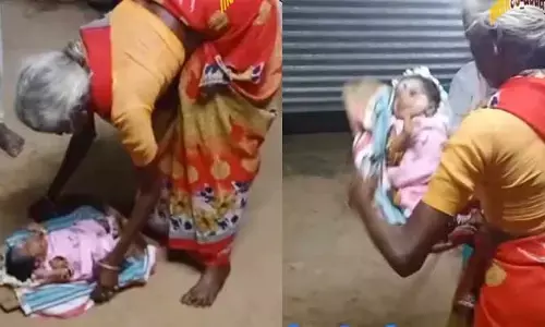 పసికందును చాటలో వేసి బియ్యం చెరిగినట్టు చెరుగుతున్న బామ్మ.. అలా ఎగిరేస్తున్నావు ఎందుకే ముసలి నక్క అంటూ ఏకిపారేస్తున్న నెటిజన్లు
