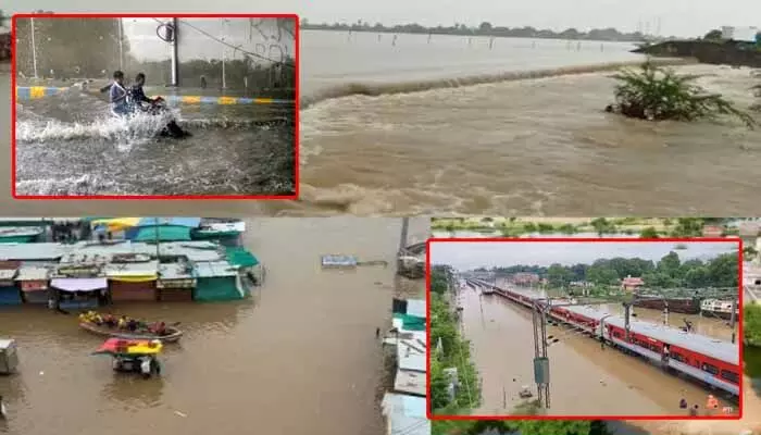 ఎడారి రాష్ట్రంలో భారీ వర్షాలు.. రైలు పట్టాలపైకి వరద నీరు ఎడారి రాష్ట్రంలో భారీ వర్షాలు.. రైలు పట్టాలపైకి వరద నీరు
