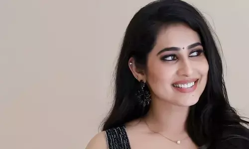 Priya Hegde looks hot in black saree