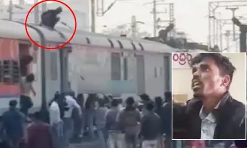 రెండు బోగీల మధ్య డేంజరస్ జర్నీ.. రైల్వే పోలీసుల అదుపులో వ్యక్తి