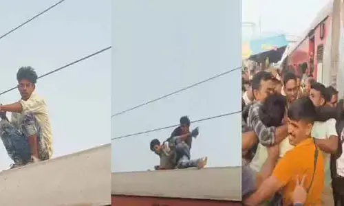 రైలు పైకి ఎక్కి యువకుడి హంగామా..