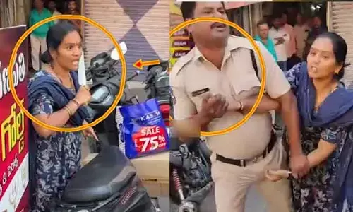 VIRAL: కత్తి పట్టుకుని వివాహిత హల్‌చల్.. నడిరోడ్డుపై భర్తను చంపేందుకు పరుగు