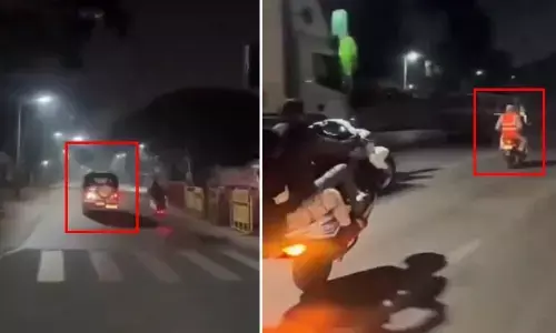 పోలీసుల ముందే బైక్ స్టంట్స్.. అర్ధరాత్రి రోడ్లపై హంగామా! వైరల్