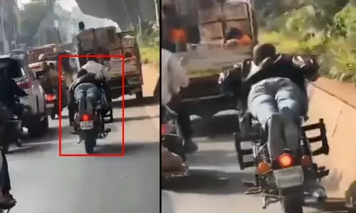 పడుకొని బైక్ నడిపిన పోకిరి.. హైదరాబాద్ ట్రాఫిక్‌లో డేంజరస్ స్టంట్స్.. వీడియో వైరల్
