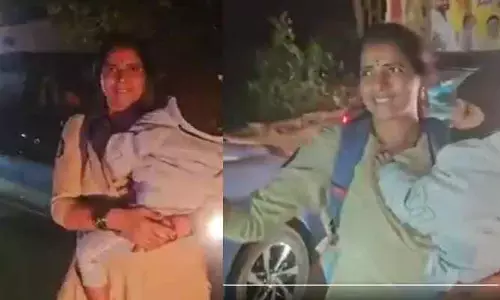 చంటిబిడ్డతో ట్రాఫిక్ క్లియర్ చేసిన మహిళా కానిస్టేబుల్