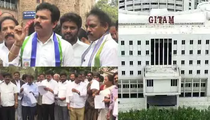 ఆ వర్సిటీకి భూములు ఇవ్వొద్దు: వైసీపీ నిరసనతో దద్దరిల్లిన కలెక్టర్ ఆ వర్సిటీకి భూములు ఇవ్వొద్దు: వైసీపీ నిరసనతో దద్దరిల్లిన కలెక్టర్