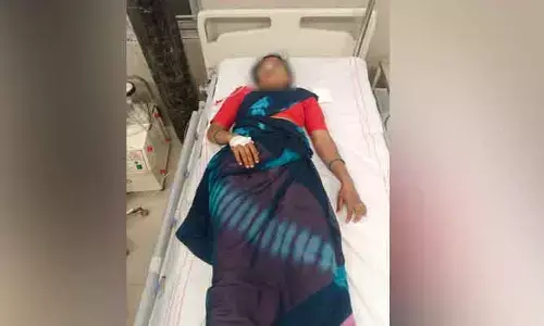 భూ వివాదంలో మహిళ ఆత్మహత్యాయత్నం