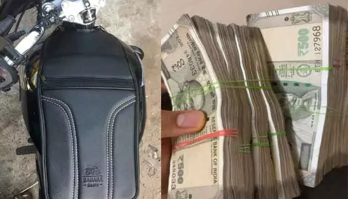 బైక్ పెట్రోల్ ట్యాంక్ కవర్ లో నుంచి రూ. 2 లక్షల నగదు చోరీ బైక్ పెట్రోల్ ట్యాంక్ కవర్ లో నుంచి రూ. 2 లక్షల నగదు చోరీ