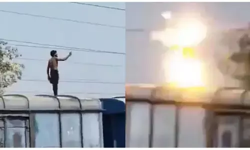 ఒళ్లు గగుర్పొడిచే ఘటన: రైలు పైకెక్కి హైవోల్టేజ్ కరెంట్ తీగను పట్టుకున్న యువకుడు.. వైరల్