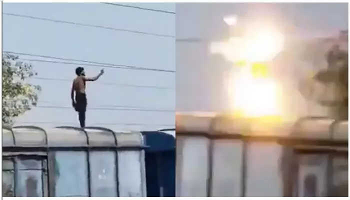 ఒళ్లు గగుర్పొడిచే ఘటన: రైలు పైకెక్కి హైవోల్టేజ్ కరెంట్ తీగను పట్టుకున్న యువకుడు.. వైరల్ ఒళ్లు గగుర్పొడిచే ఘటన: రైలు పైకెక్కి హైవోల్టేజ్ కరెంట్ తీగను పట్టుకున్న యువకుడు.. వైరల్
