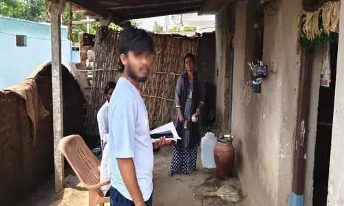 ప్రభుత్వ ఉద్యోగికి బదులు కొడుకుతో సర్వే