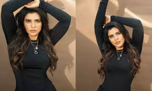 బ్లాక్ కలర్ డ్రెస్‌లో చేతులు పైకెత్తి స్టైలిష్ లుక్‌లో ఆకట్టుకున్న ఐశ్వర్య రాజేష్