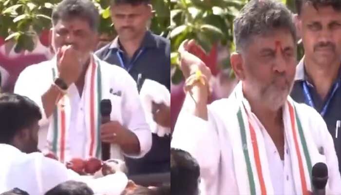 చిక్కుల్లో కర్ణాటక సీఎం.. యాపిల్ కొరికి జనంలోకి విసిరేసిన డీకే శివకుమార్