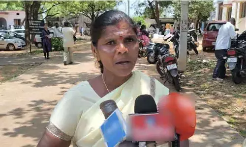 పెట్రోల్ డబ్బాతో మహిళా రైతు ఆత్మహత్యాయత్నం