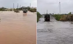 భారీ వర్షం.. నేషనల్ హైవేపై కిలోమీటర్ల మేర నిలిచిన వాహనాలు భారీ వర్షం.. నేషనల్ హైవేపై కిలోమీటర్ల మేర నిలిచిన వాహనాలు