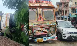 నిద్రమత్తులో సెంటర్ డివైడర్‌ను ఢీకొట్టిన లారీ..