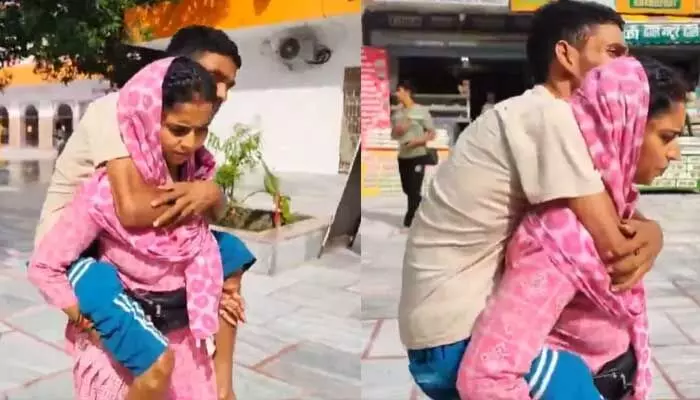 180కిమీలు భర్తను వీపుపై మోసిన భార్య 180కిమీలు భర్తను వీపుపై మోసిన భార్య