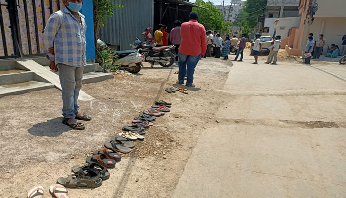 footwear kept in queue for vaccine